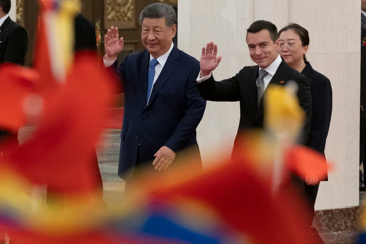Ecuadorian President Daniel Noboa waves alongside Chinese President Xi Jinping during a welcome ceremony in Beijing.