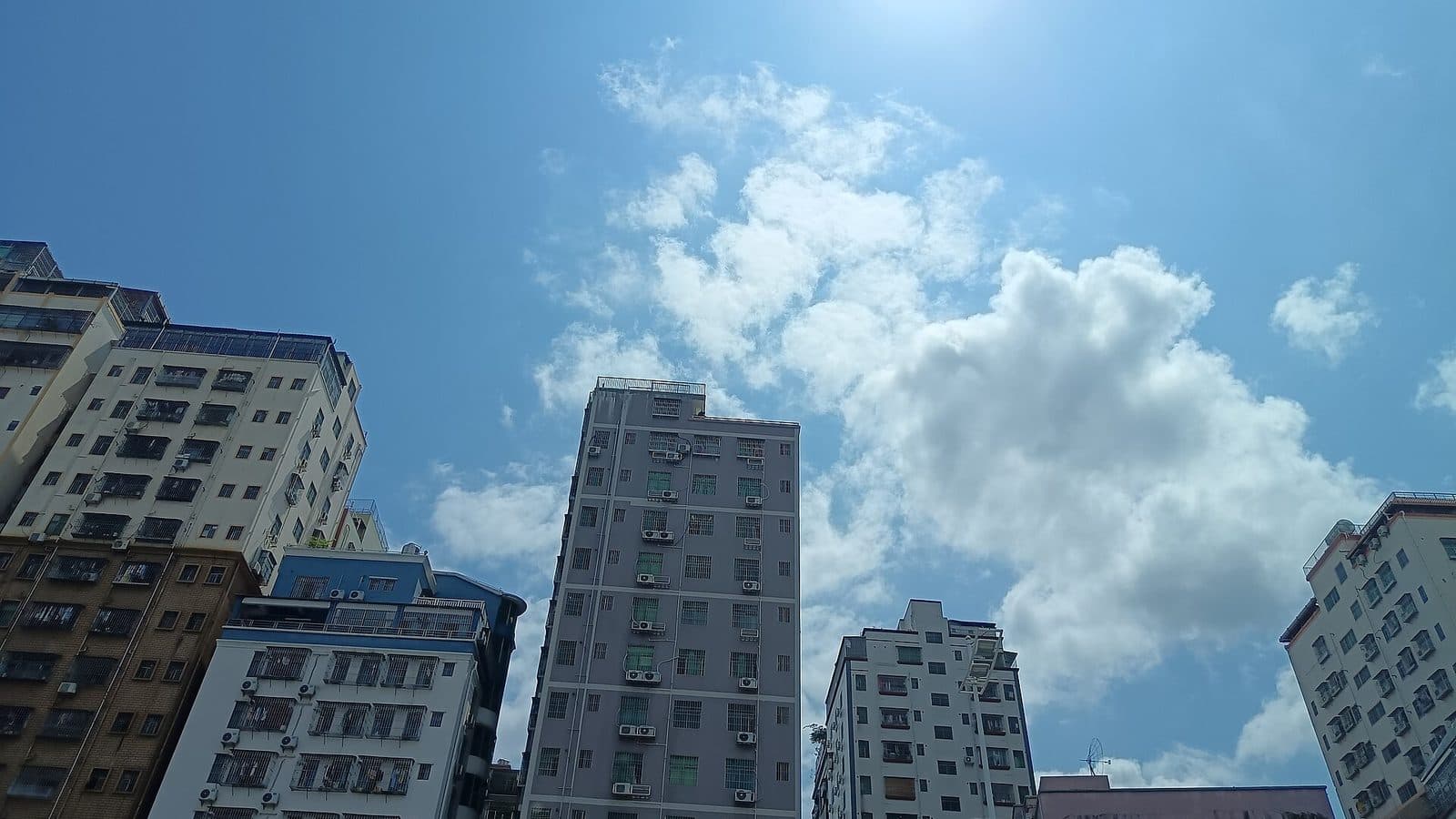 Residential apartment towers against a blue sky in Shenzhen, China